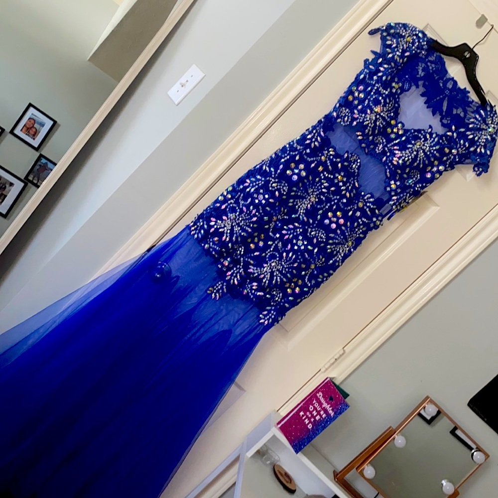 Royal blue with lace gown never worn. Purchased for a prom. Still has tags
